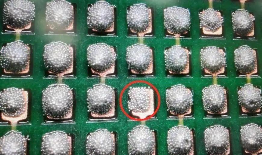 solder bridging defect between IC leads on PCB
