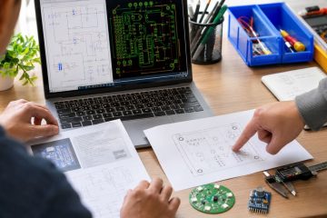 Beginner PCB designer reviewing a schematic, layout, footprint and first manufactured boards