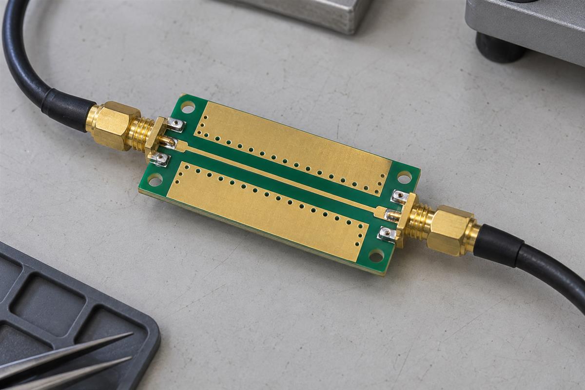 Illustrative RF test coupon with coaxial cables connected at both ends