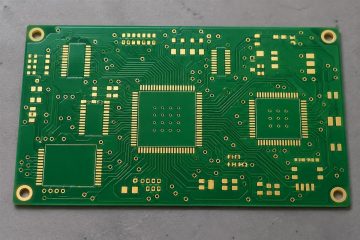 Illustrative bare PCB with fine-pitch gold-colored pads and solder mask