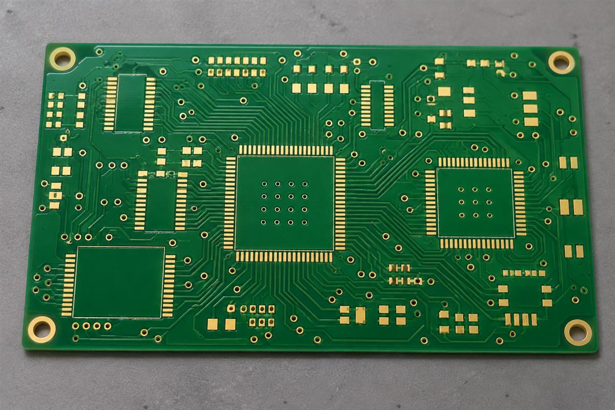 Illustrative bare PCB with fine-pitch gold-colored pads and solder mask