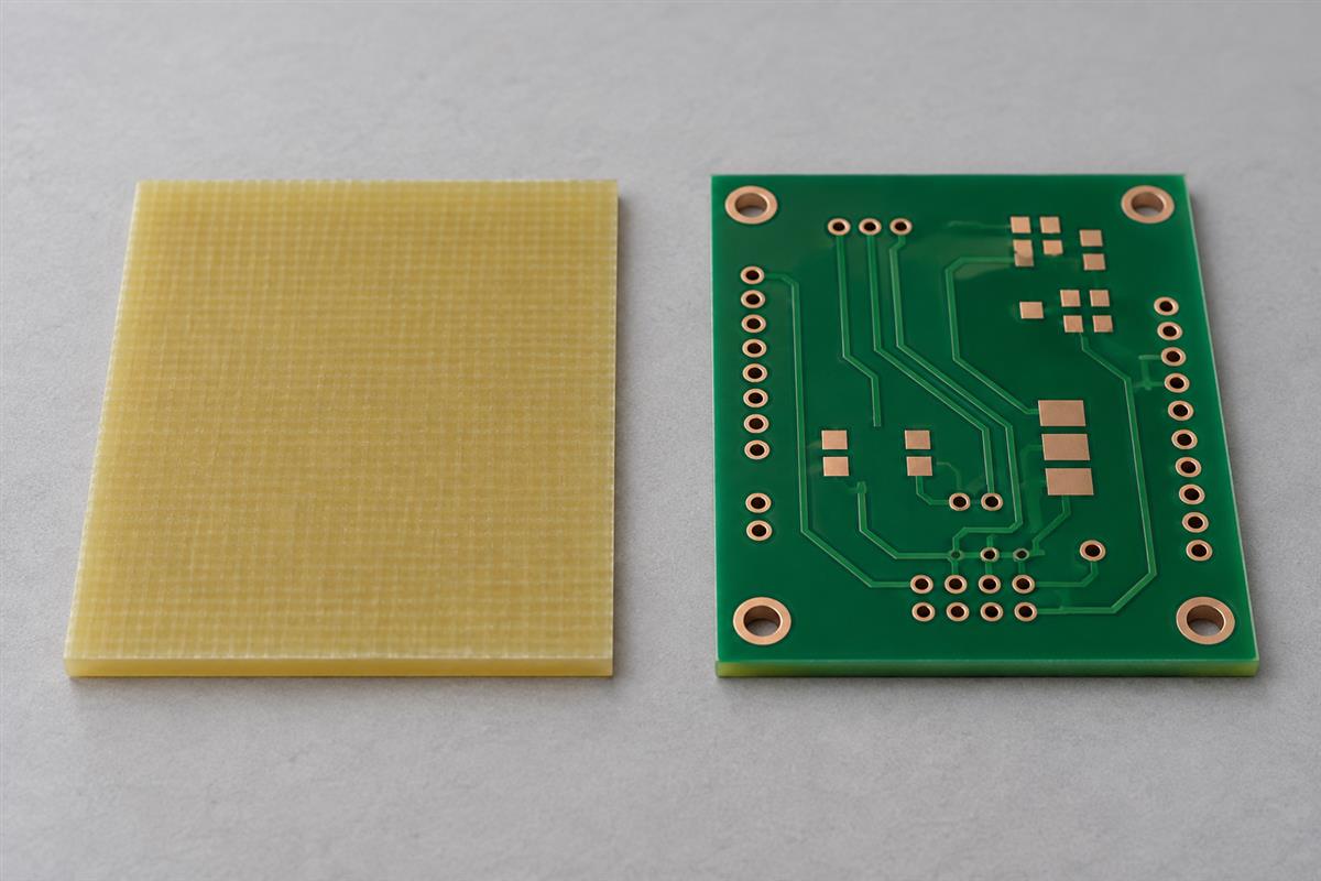 Glass epoxy substrate sample beside a bare PCB, AI illustration