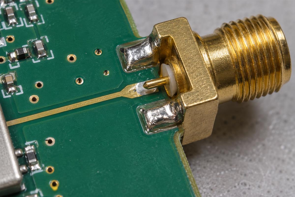 Illustrative SMA connector center pin and PCB trace transition