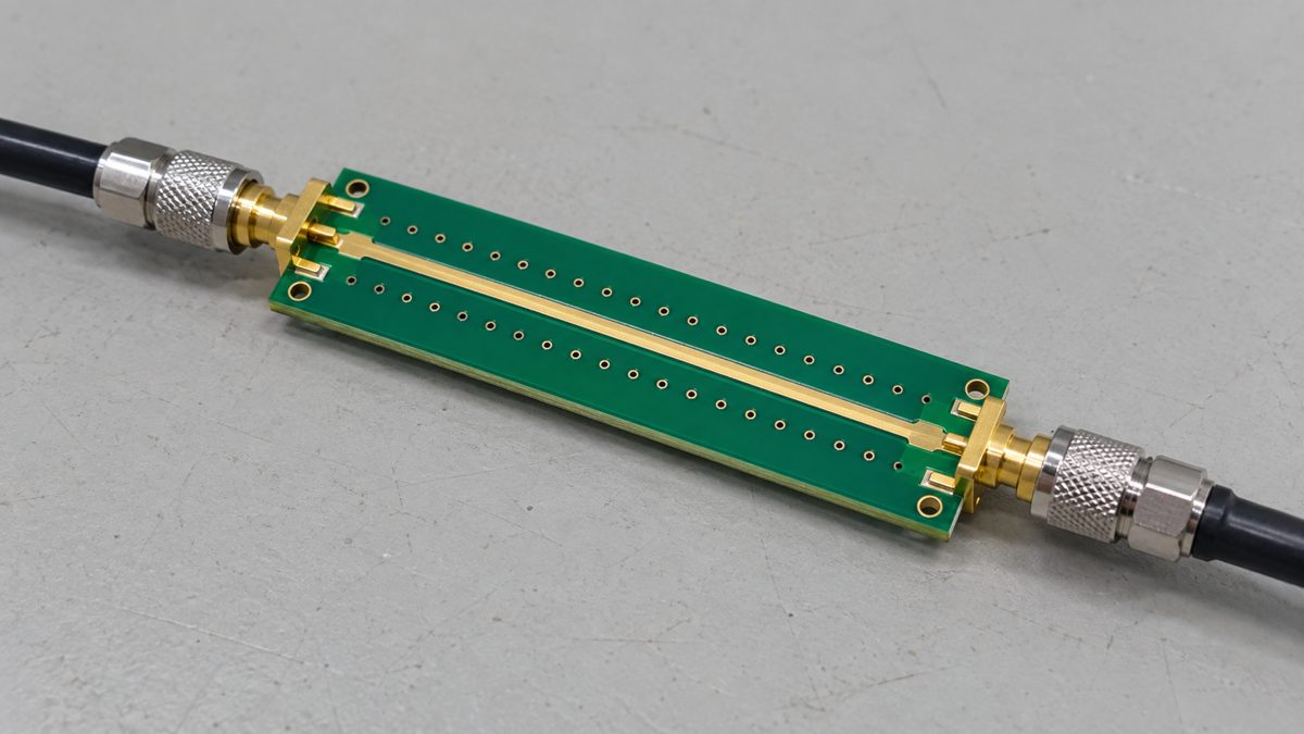 Illustrative RF test coupon connected at both ends to coaxial test cables