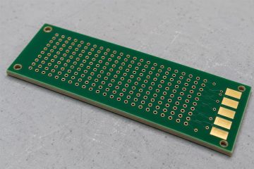 Illustrative bare multilayer PCB coupon with closely spaced plated holes