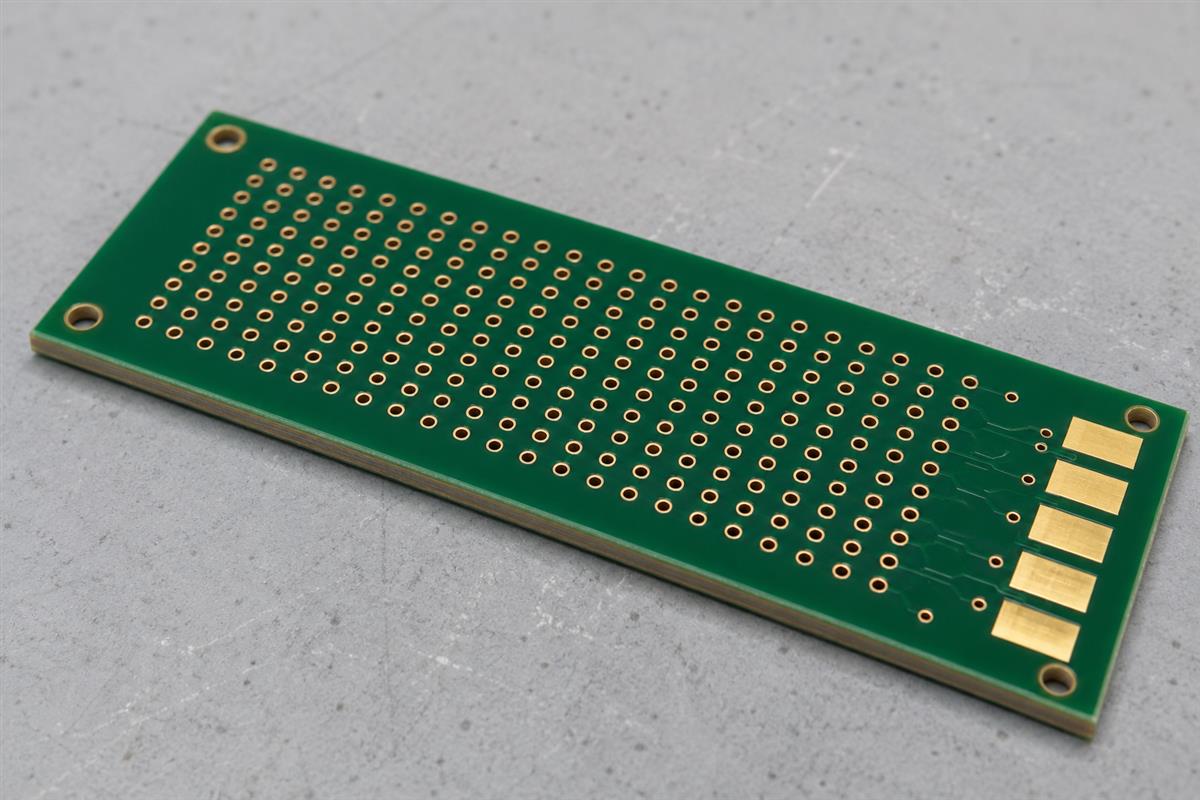 Illustrative bare multilayer PCB coupon with closely spaced plated holes