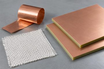Woven glass reinforcement and copper foil samples beside copper-clad laminate