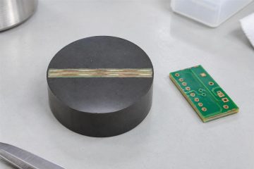 Illustrative PCB specimen embedded in a round metallographic resin mount