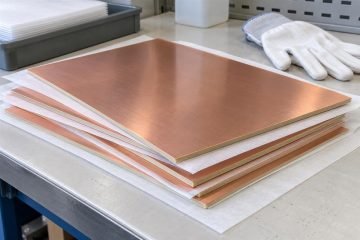 Copper clad laminate sheets supported flat with protective separators