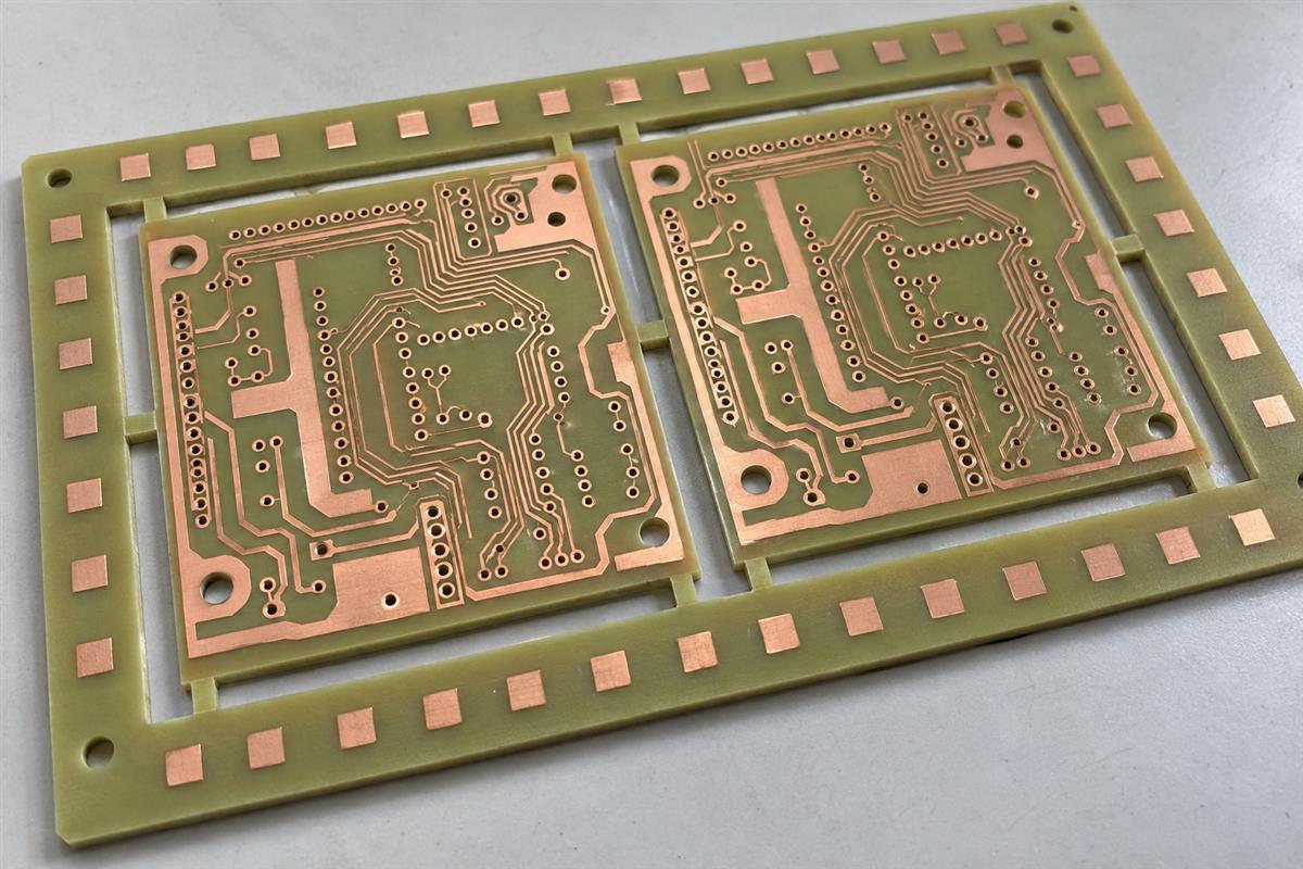 Illustrative PCB panel with copper balancing features on the surrounding production rails