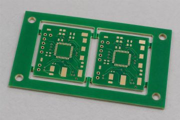 Illustrative PCB panel with tooling holes in its handling rails