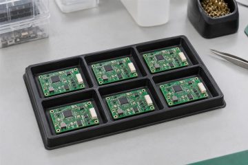 Small batch of assembled circuit boards arranged in an ESD tray for pilot review
