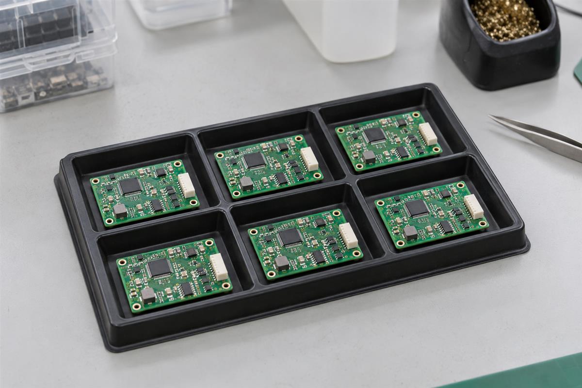 Small batch of assembled circuit boards arranged in an ESD tray for pilot review